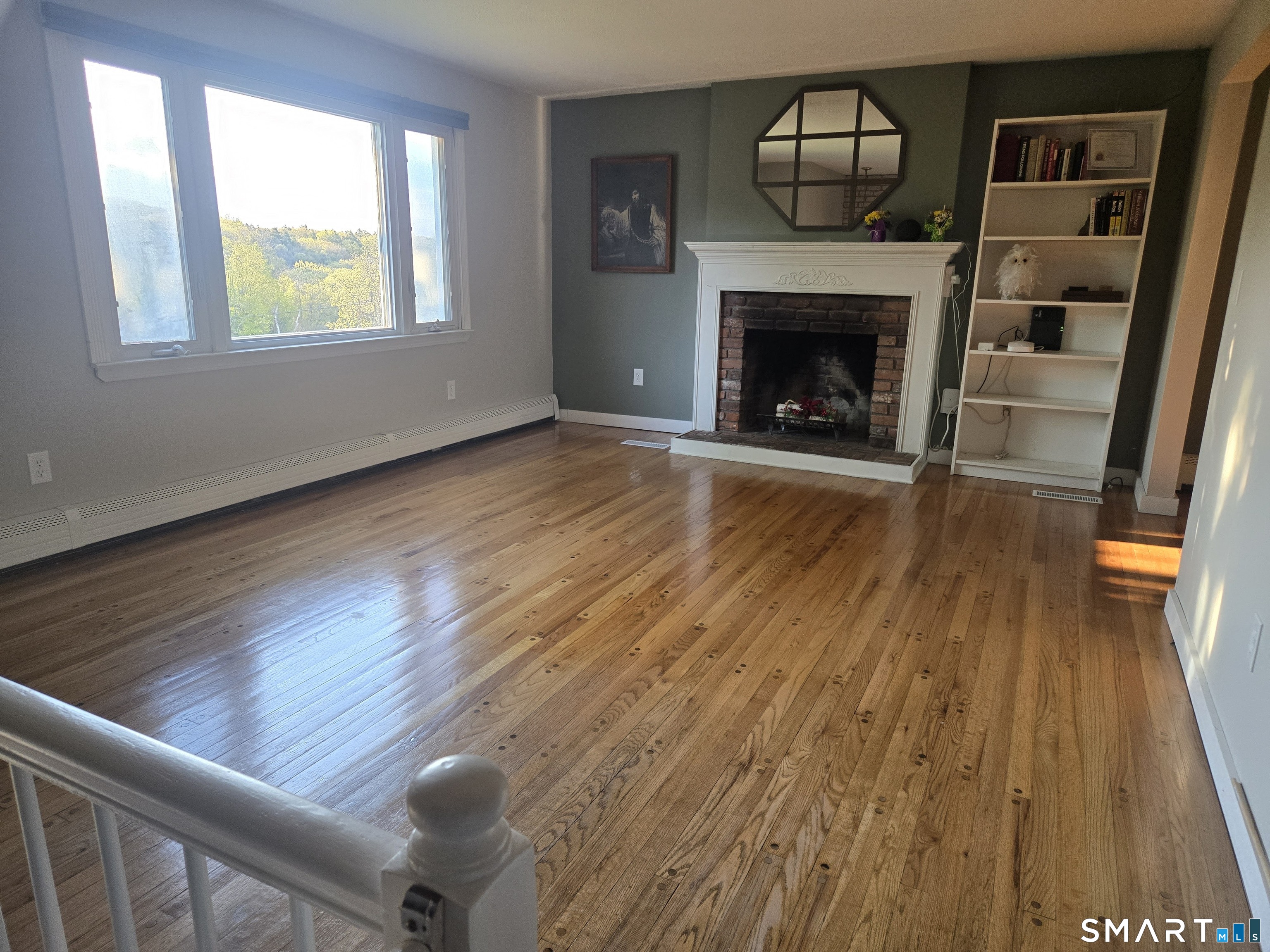 1004 Hickory Hill Road Thomaston, CT 06787 - Photo 13 of 23 a living room with furniture and a fireplace
