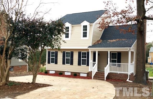 3824 Old Coach Road Raleigh, NC 27616 - Photo 1 of 25 a front view of a house with a tree