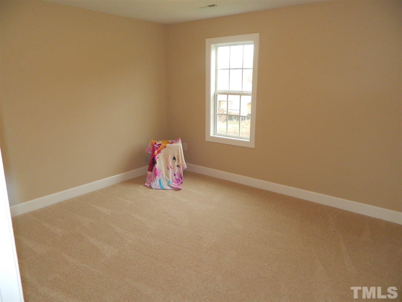 3824 Old Coach Road Raleigh, NC 27616 - Photo 17 of 25 an empty room with a window