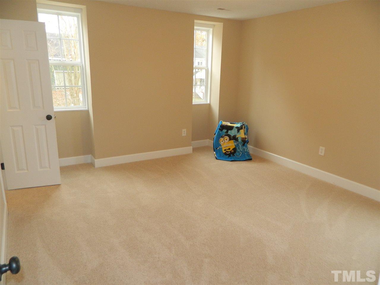 3824 Old Coach Road Raleigh, NC 27616 - Photo 19 of 25 an empty room with windows