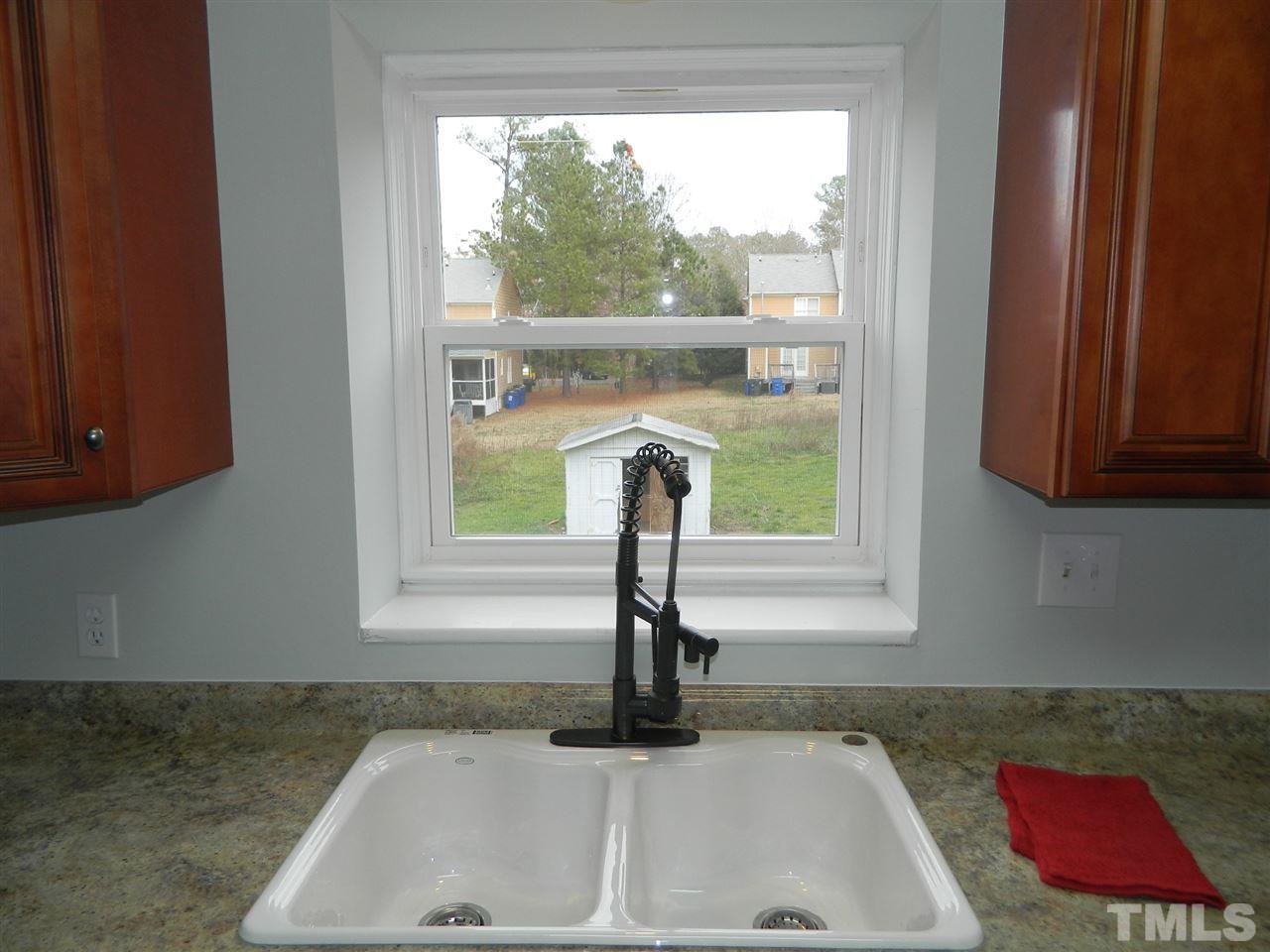 3824 Old Coach Road Raleigh, NC 27616 - Photo 8 of 25 a bathroom with a sink and window