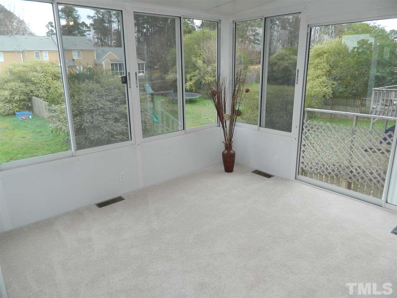 3824 Old Coach Road Raleigh, NC 27616 - Photo 9 of 25 a view of a room with sliding glass door and garden view