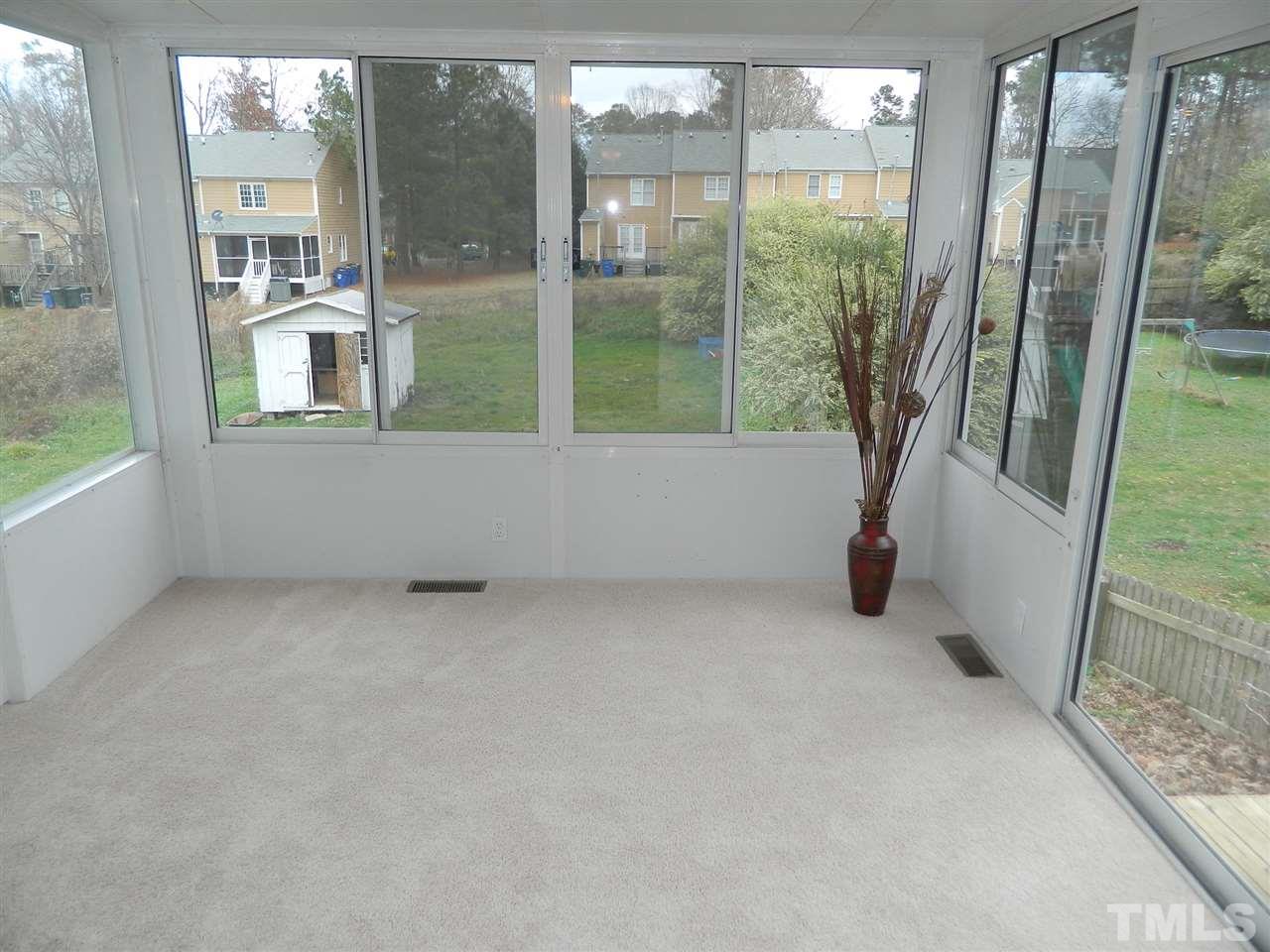 3824 Old Coach Road Raleigh, NC 27616 - Photo 10 of 25 an empty room with large windows