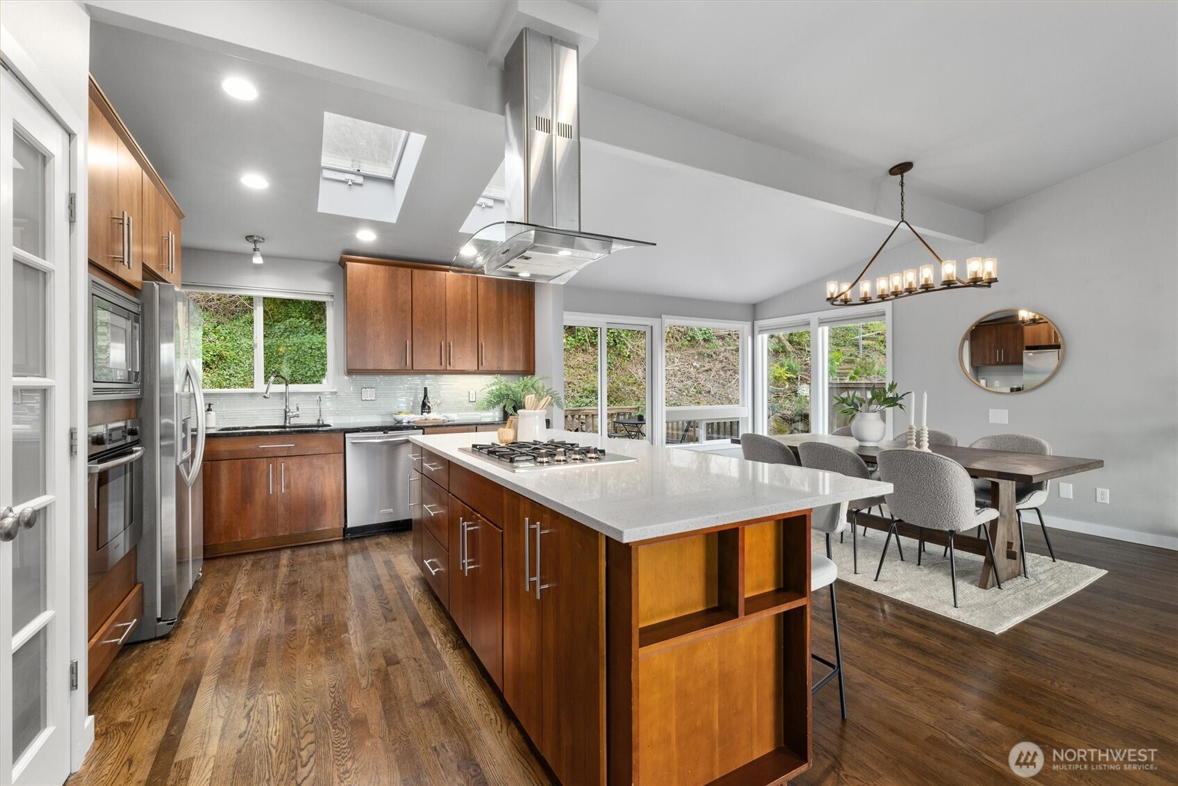 8620 Vashon View Southwest Seattle, WA 98136 - Photo 14 of 40 a large kitchen with kitchen island a large island in it