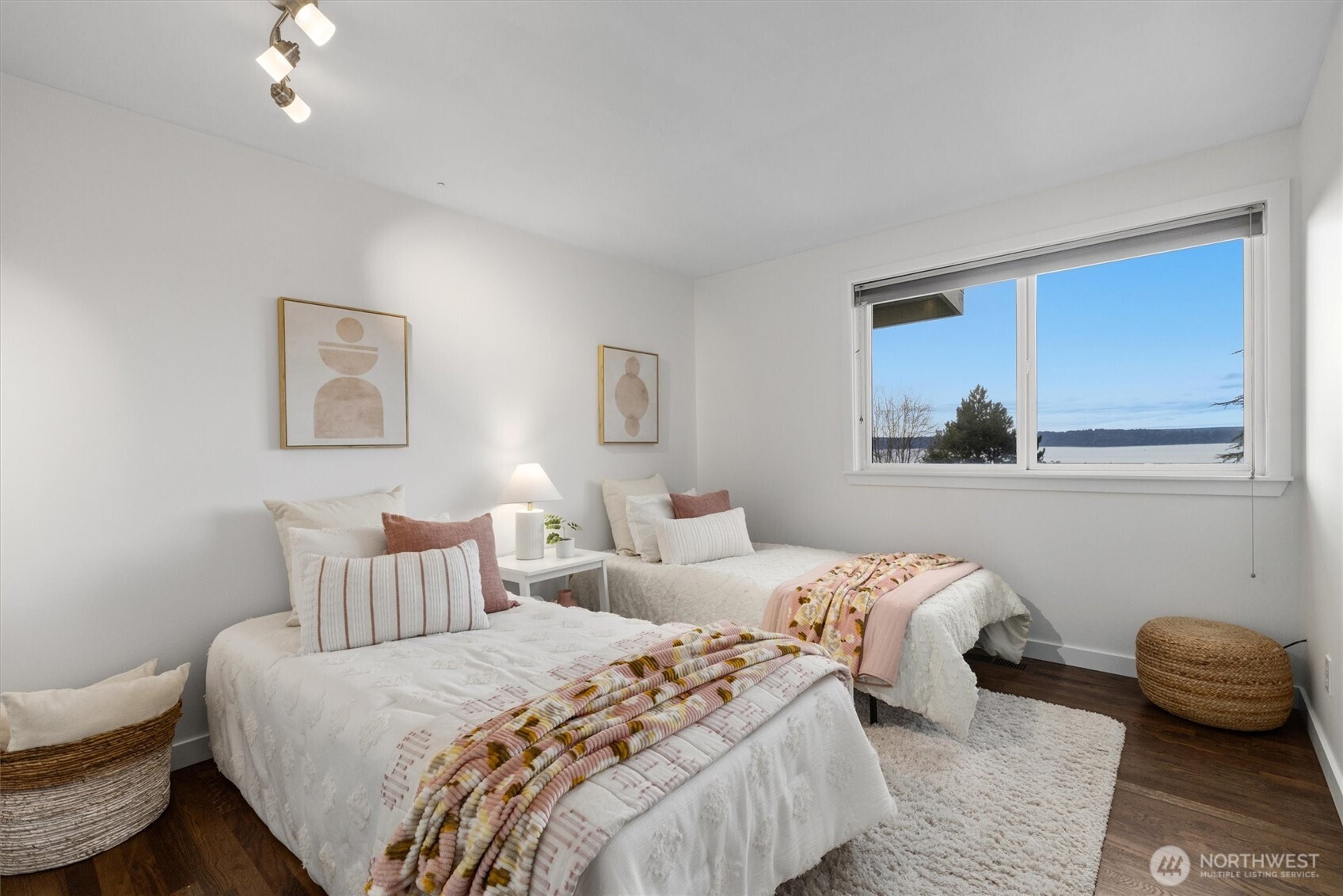 8620 Vashon View Southwest Seattle, WA 98136 - Photo 17 of 40 a bedroom with a bed and a painting on the wall