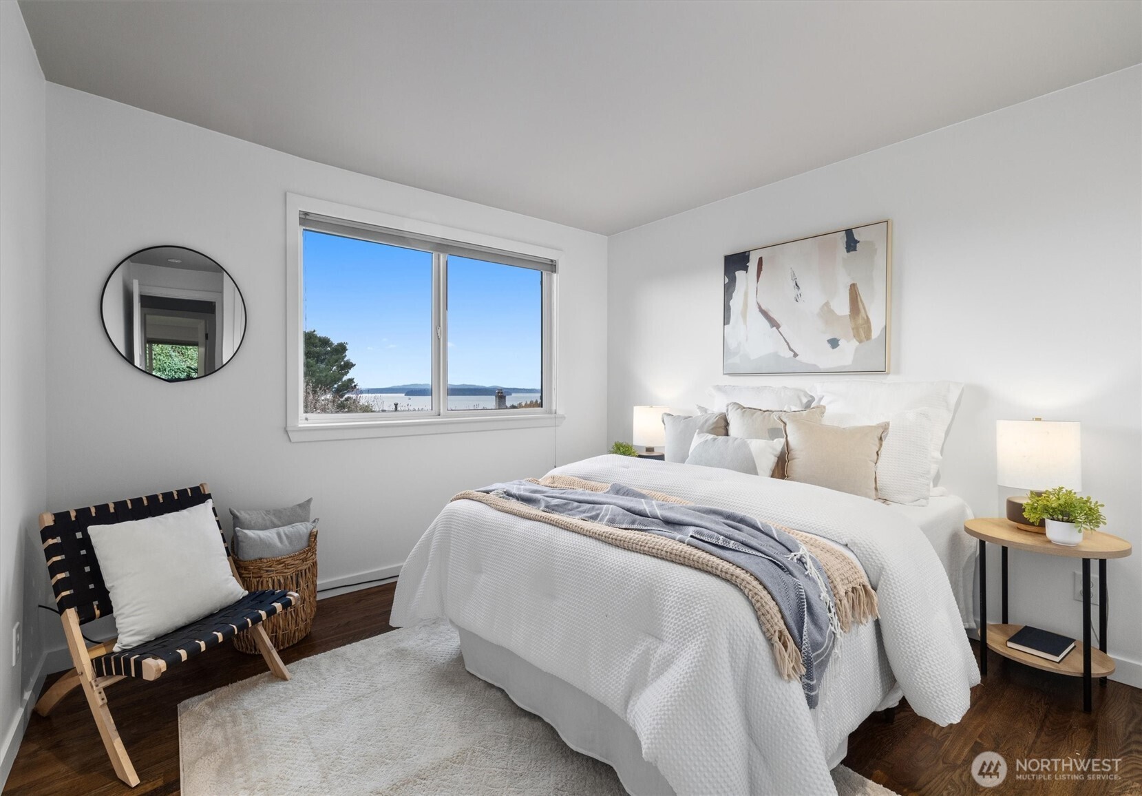 8620 Vashon View Southwest Seattle, WA 98136 - Photo 18 of 40 a bedroom with a bed and a chair