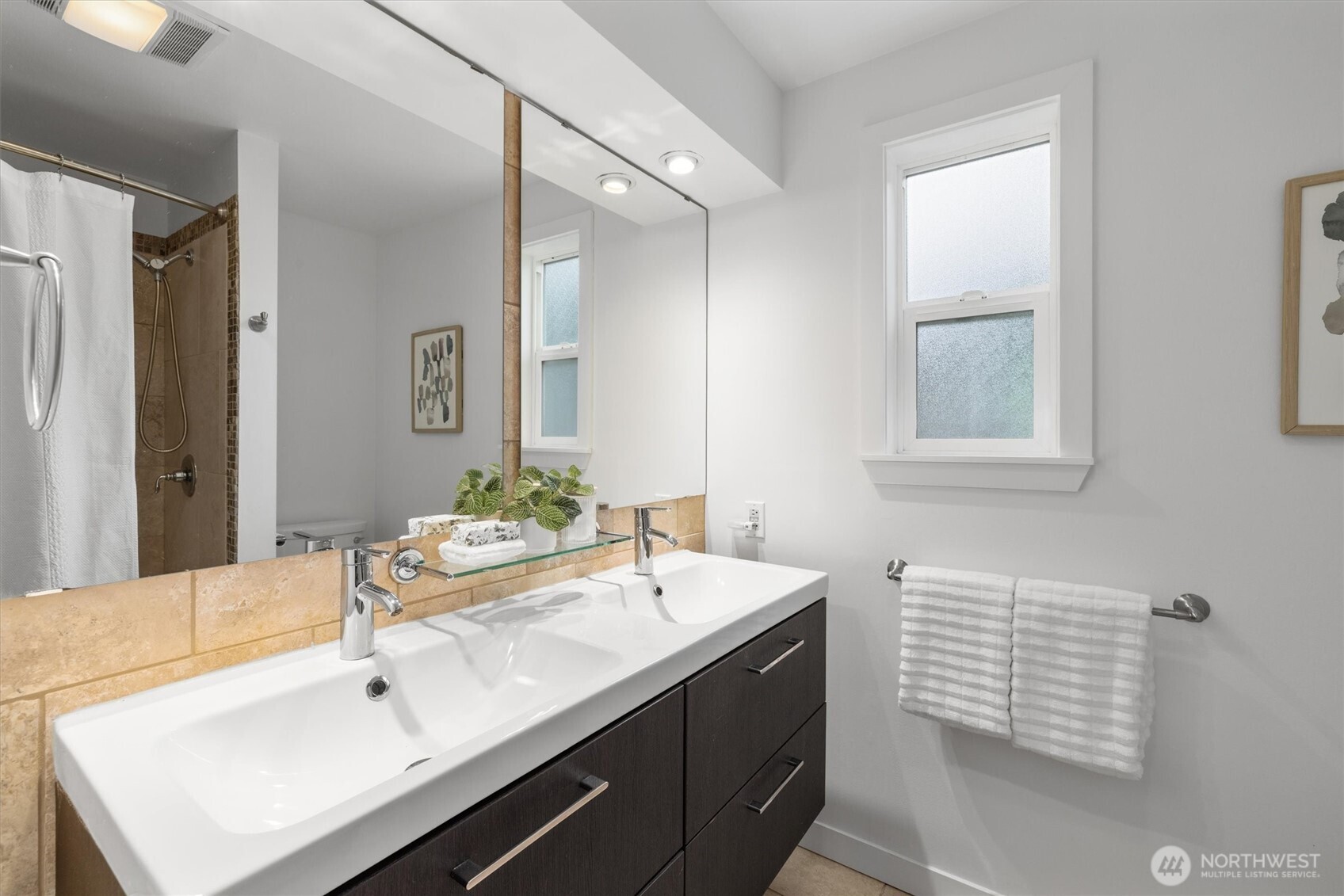 8620 Vashon View Southwest Seattle, WA 98136 - Photo 20 of 40 a bathroom with a sink and a mirror