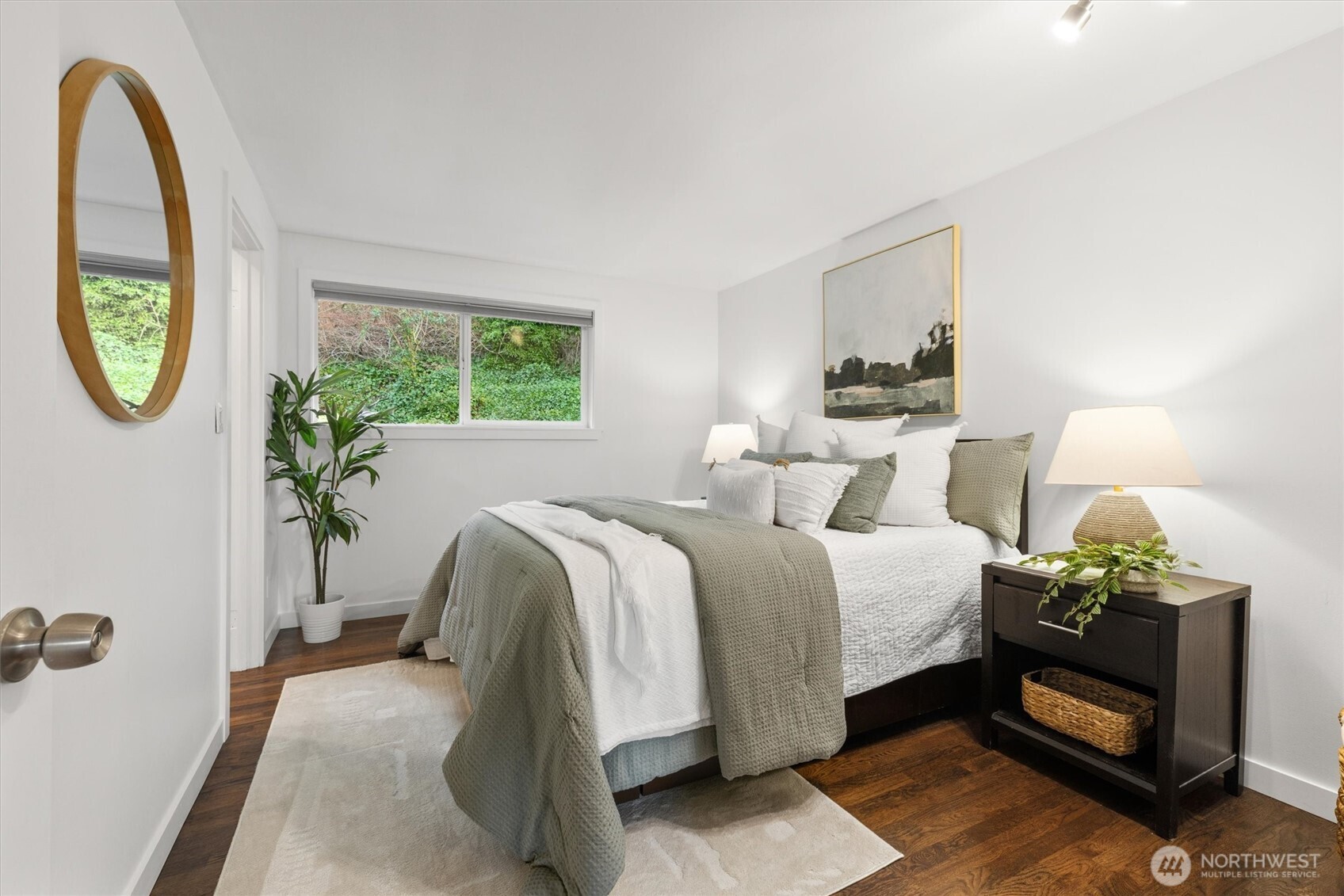 8620 Vashon View Southwest Seattle, WA 98136 - Photo 21 of 40 a bed sitting in a bedroom next to a window