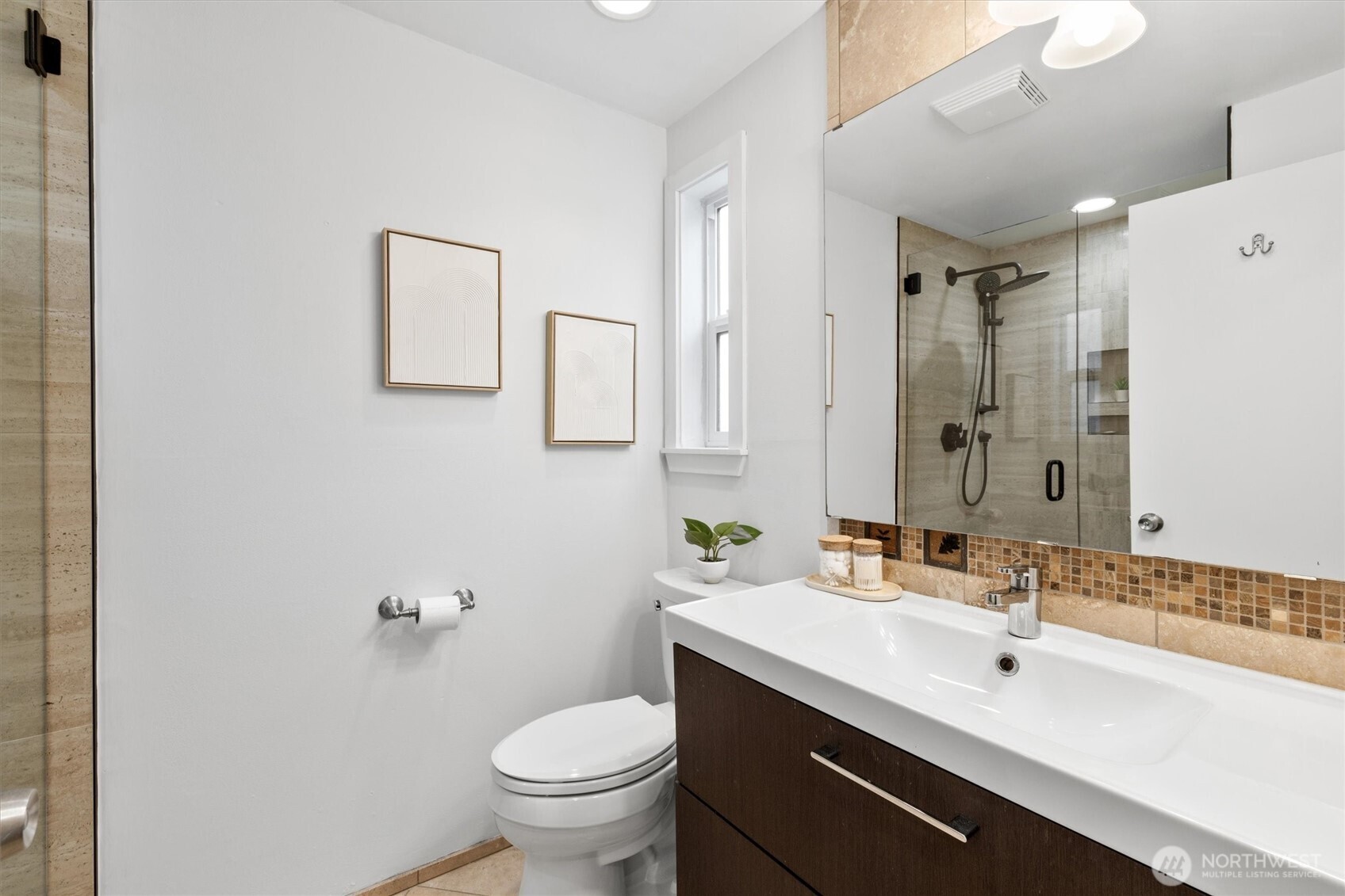 8620 Vashon View Southwest Seattle, WA 98136 - Photo 24 of 40 a bathroom with a sink toilet and shower