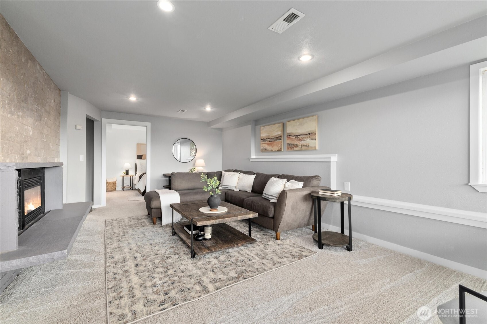 8620 Vashon View Southwest Seattle, WA 98136 - Photo 25 of 40 a living room with furniture and a fireplace
