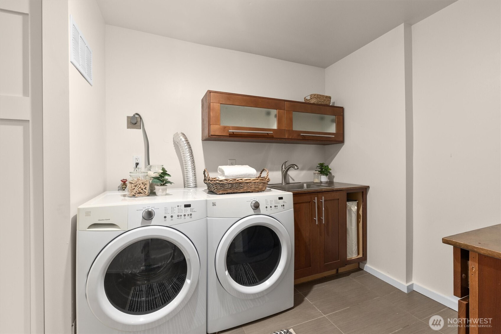 8620 Vashon View Southwest Seattle, WA 98136 - Photo 29 of 40 a utility room with dryer and washer