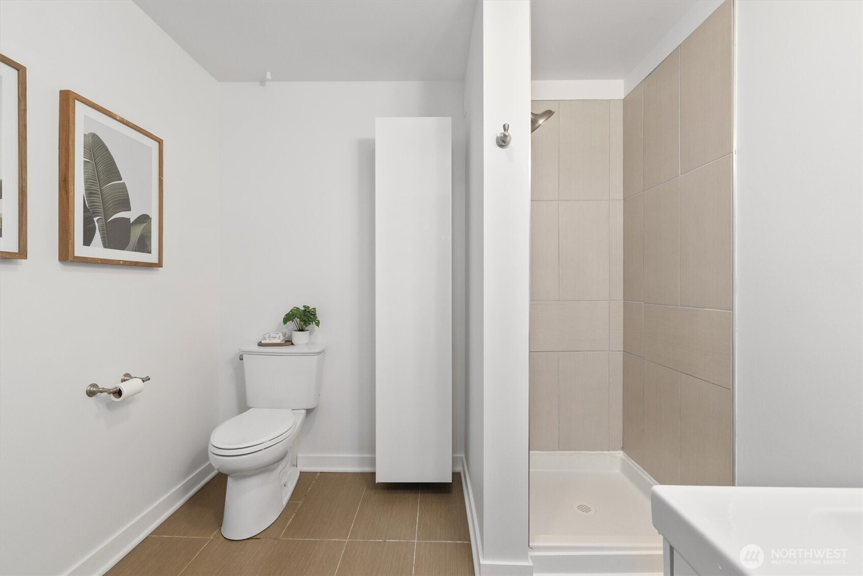 8620 Vashon View Southwest Seattle, WA 98136 - Photo 31 of 40 a white toilet sitting next to a bathroom sink