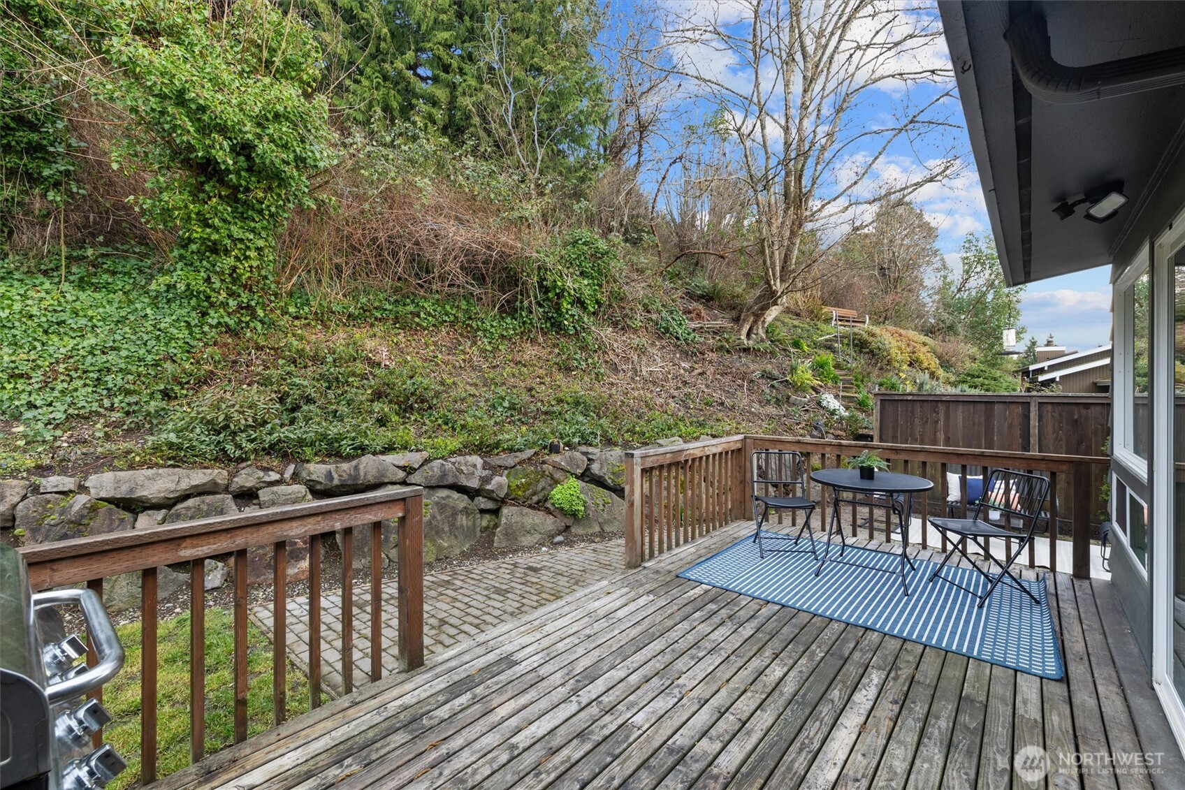 8620 Vashon View Southwest Seattle, WA 98136 - Photo 33 of 40 a view of a roof deck with table and chairs and wooden floor
