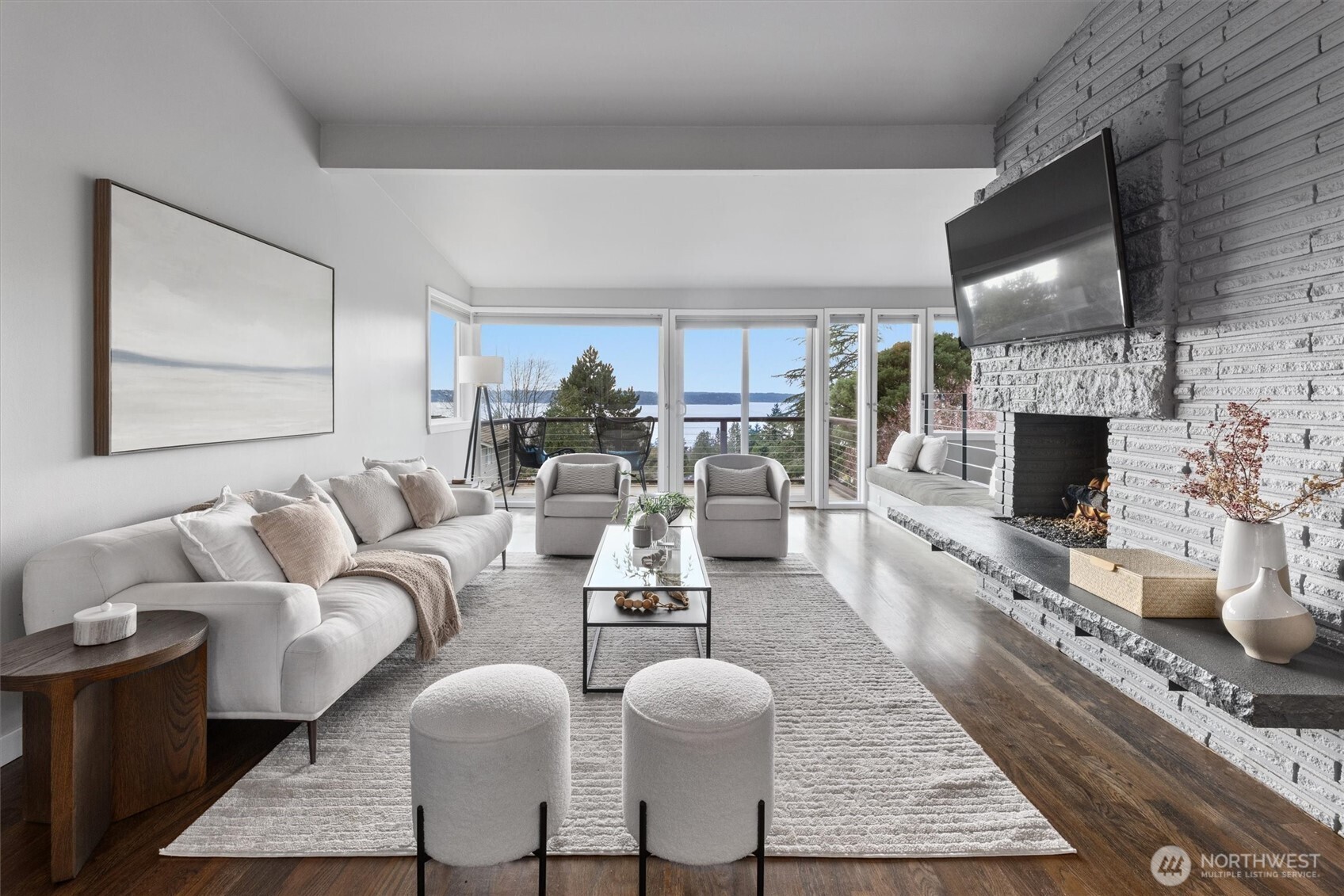 8620 Vashon View Southwest Seattle, WA 98136 - Photo 5 of 40 a living room with furniture wooden floor and a fireplace