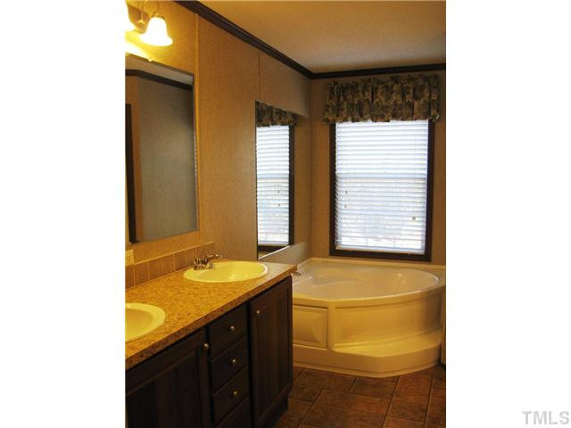 7309 Trouble Road Willow Spring, NC 27592 - Photo 10 of 22 Luxury master BA - dual vanity & garden tub! Master Bath/Spa