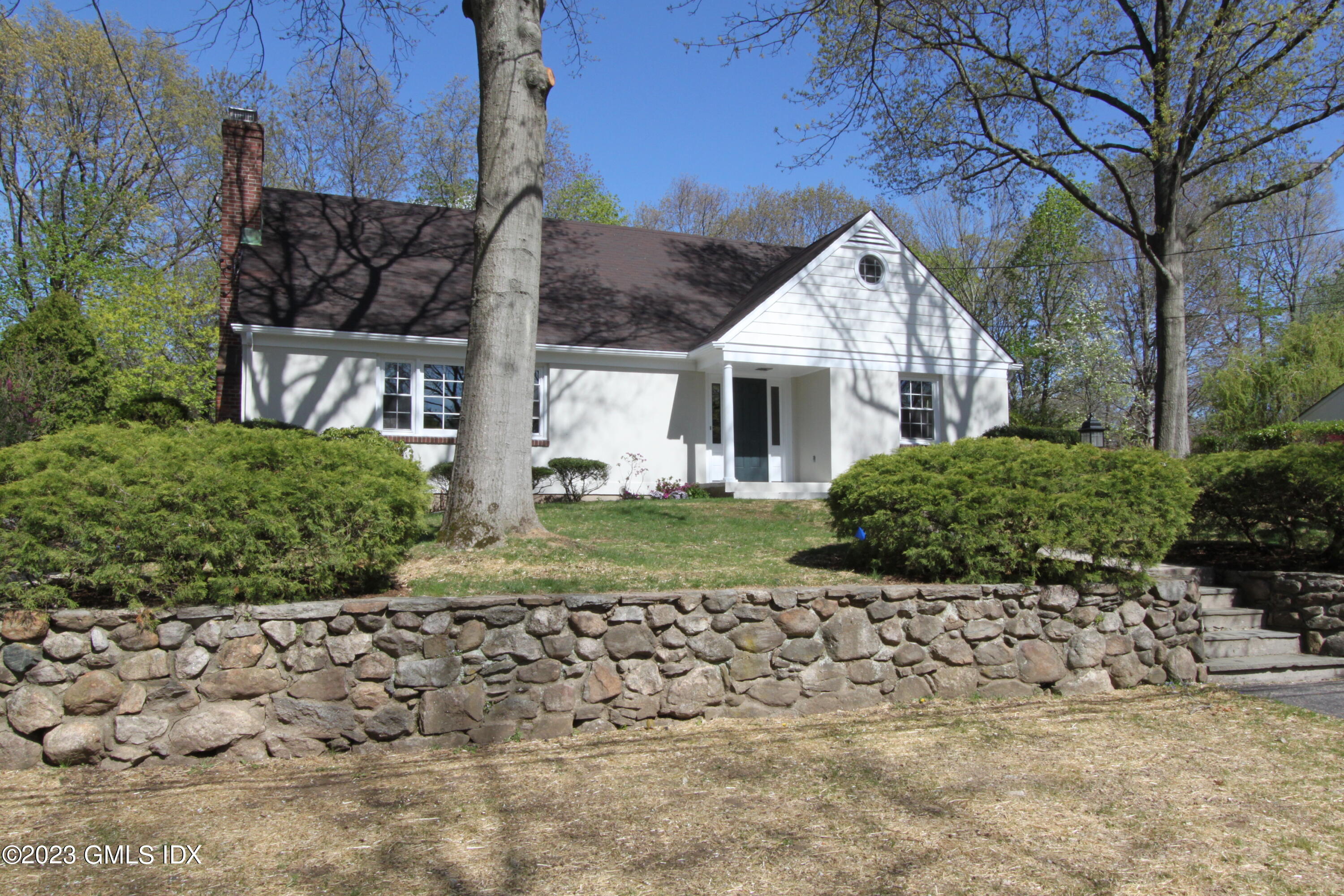 11 Manor Road Old Greenwich, CT 06870 - Photo 18 of 19 a view of a house with a yard