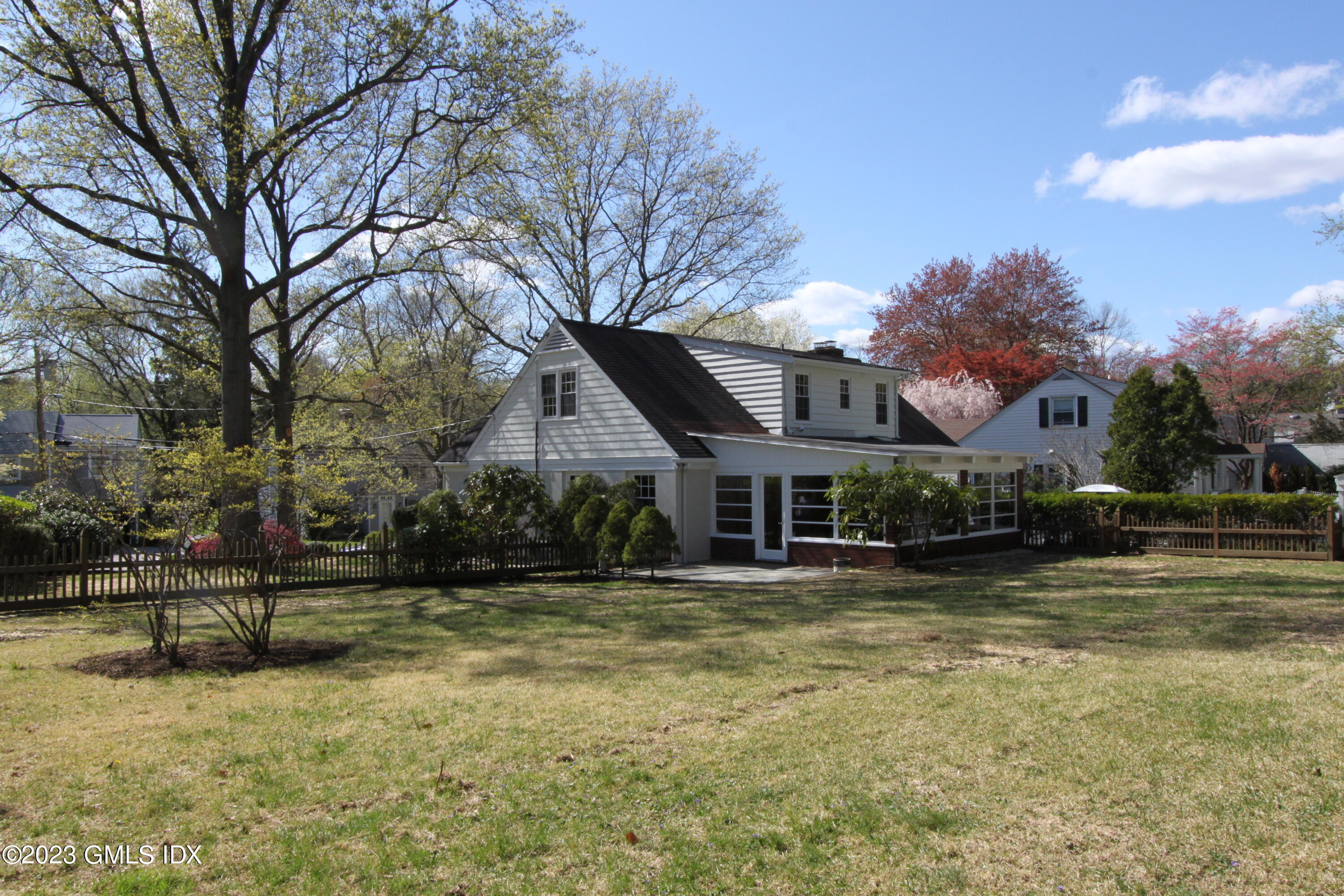11 Manor Road Old Greenwich, CT 06870 - Photo 19 of 19 a front view of a house with a yard