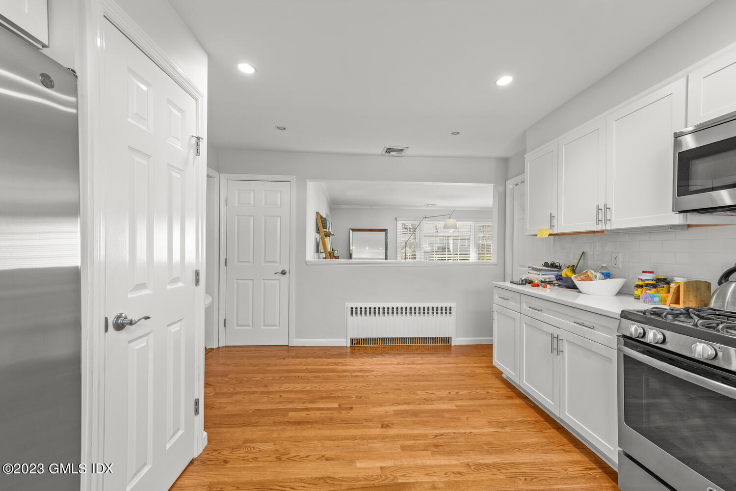 11 Manor Road Old Greenwich, CT 06870 - Photo 5 of 19 a large white kitchen with white cabinets