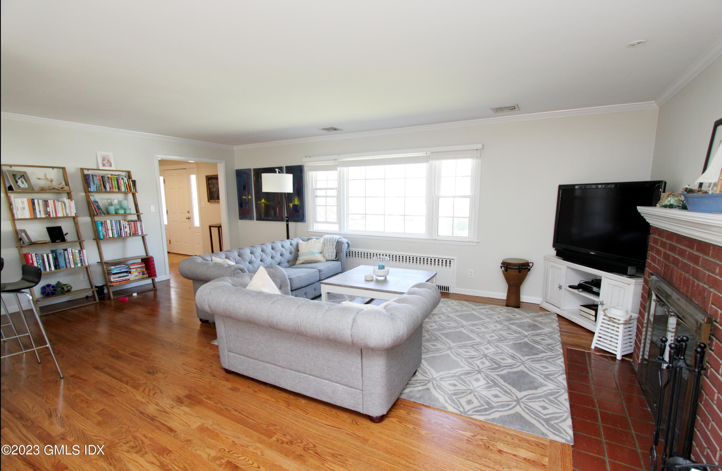 11 Manor Road Old Greenwich, CT 06870 - Photo 7 of 19 a living room with furniture and a flat screen tv