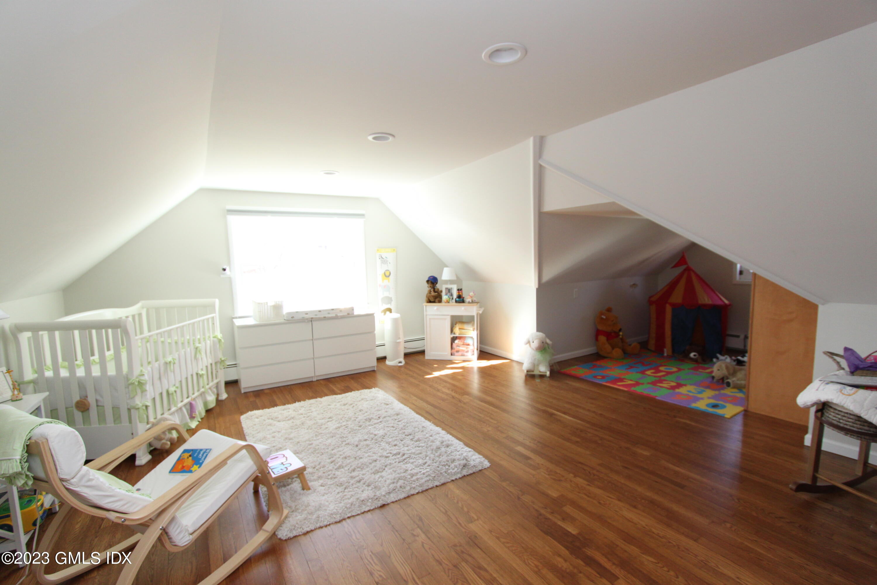 11 Manor Road Old Greenwich, CT 06870 - Photo 10 of 19 a living room with furniture and a wooden floor