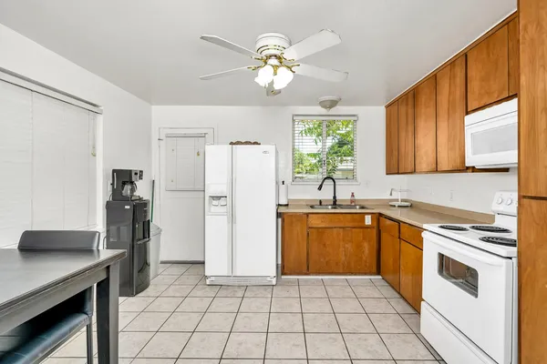 a kitchen with a refrigerator a sink and dishwasher