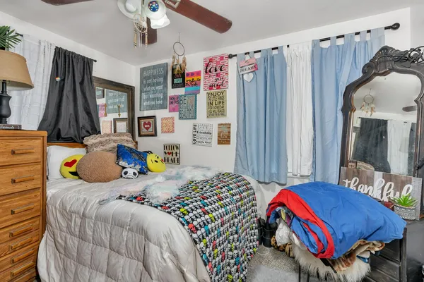 a bedroom that has a bed and a closet