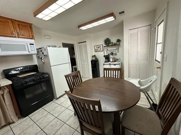 a view of a dining room with furniture