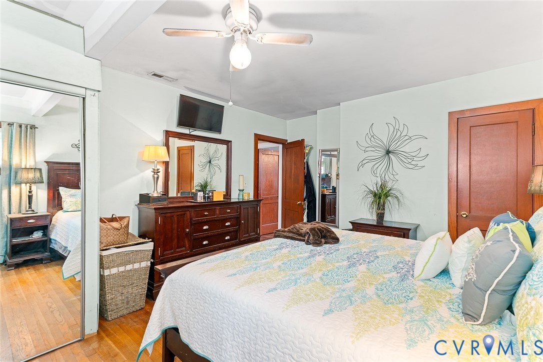9261 South Courthouse Road Providence Forge, VA 23140 - Photo 23 of 24 a bedroom with a bed and wooden floor