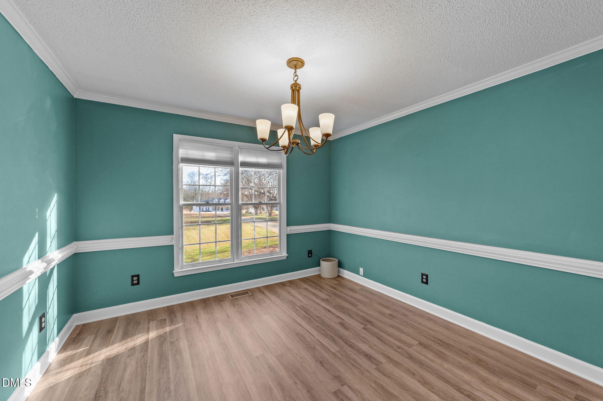 1030 Loop Road Clayton, NC 27527 - Photo 5 of 20 a room with painting on the wall and a window