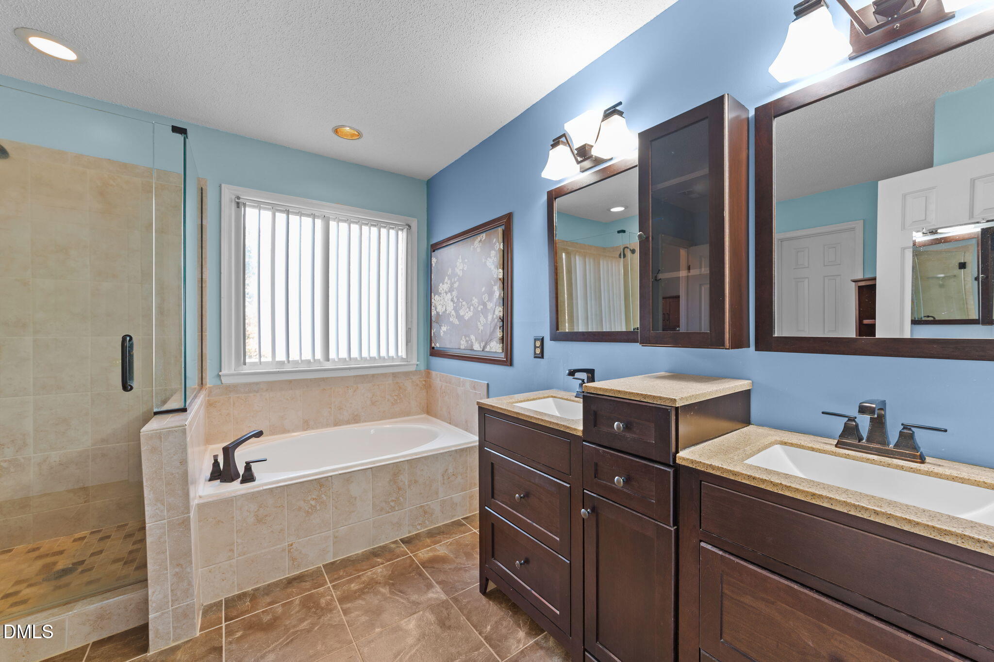 1030 Loop Road Clayton, NC 27527 - Photo 9 of 20 a spacious bathroom with a tub sink and mirror
