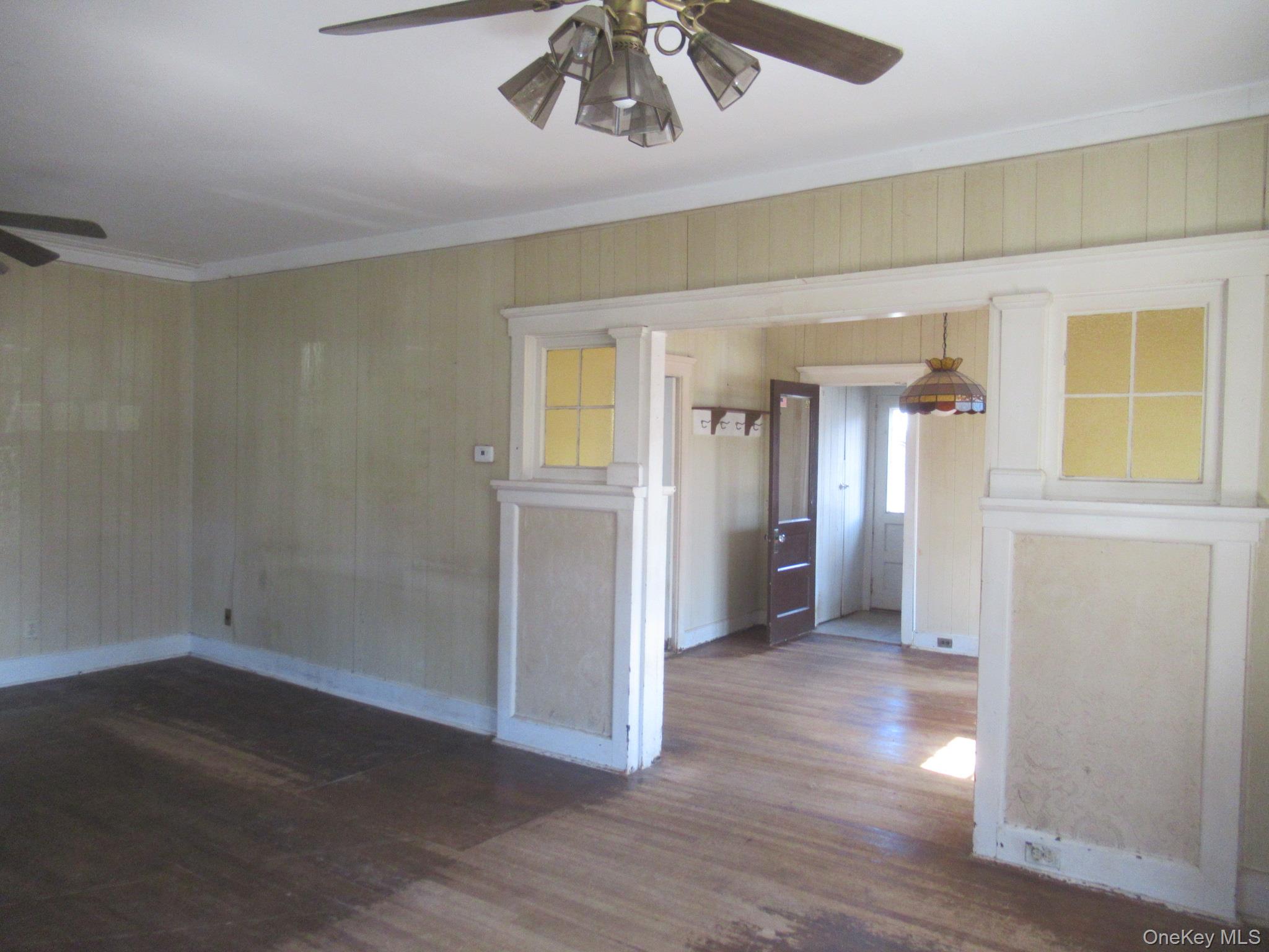 72 Waterstone Road Greenwood Lake, NY 10925 - Photo 12 of 20 Hardwood flooring extending throughout, complemented by a ceiling fan with integrated lighting