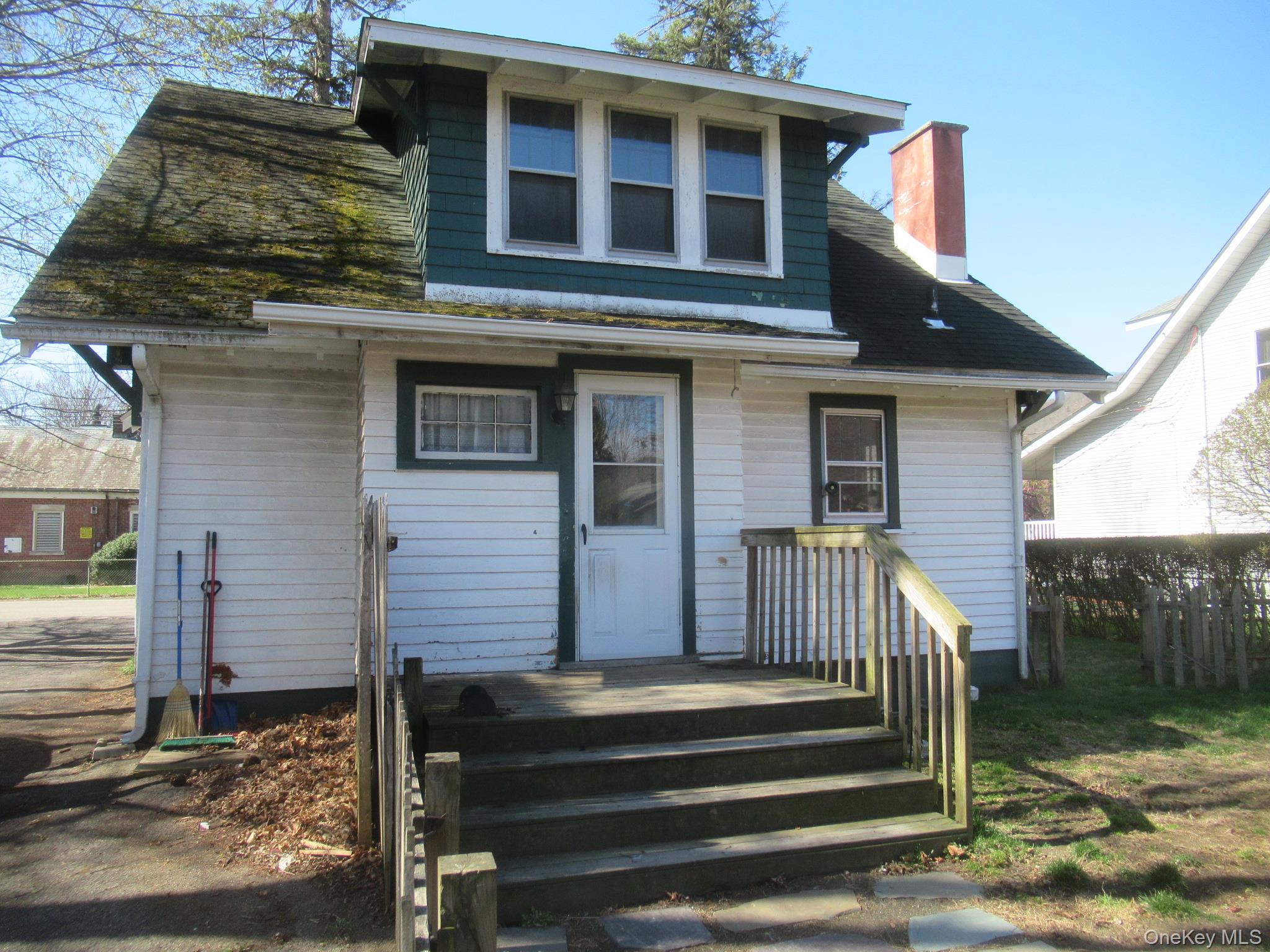 72 Waterstone Road Greenwood Lake, NY 10925 - Photo 19 of 20 White siding exterior with a dark green gabled dormer