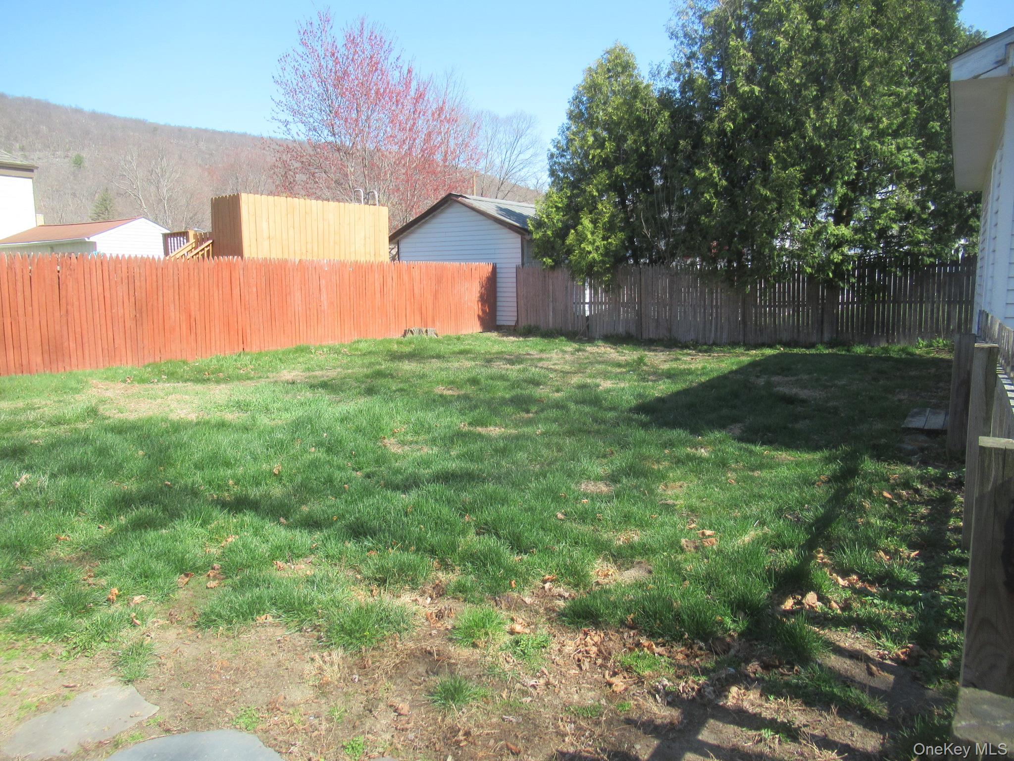 72 Waterstone Road Greenwood Lake, NY 10925 - Photo 20 of 20 Fenced backyard with established green lawn