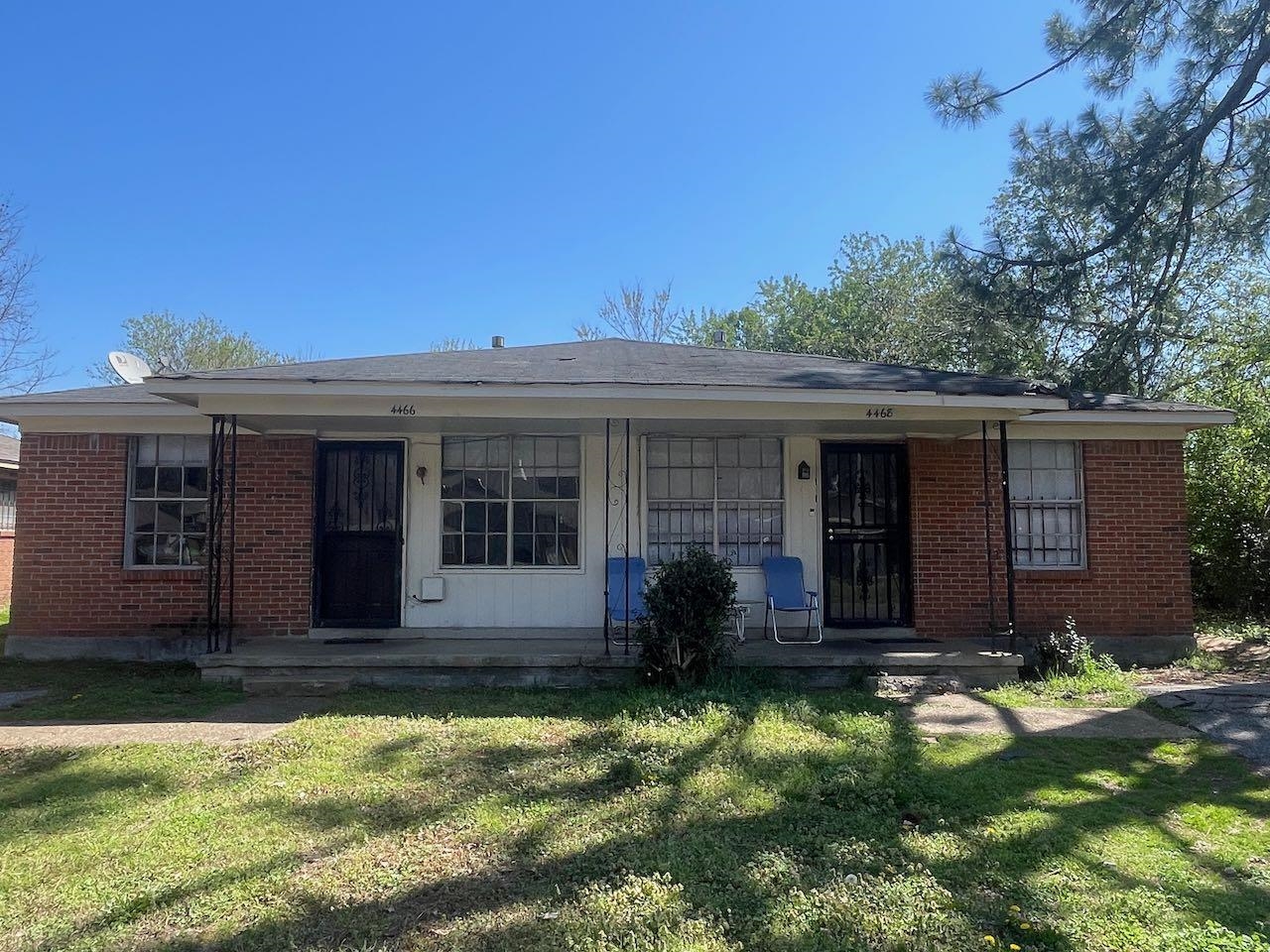 front view of a house with a yard