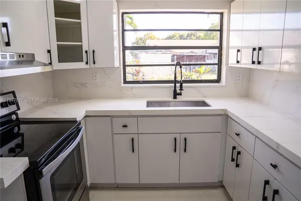 a view of a bathroom from the hallway