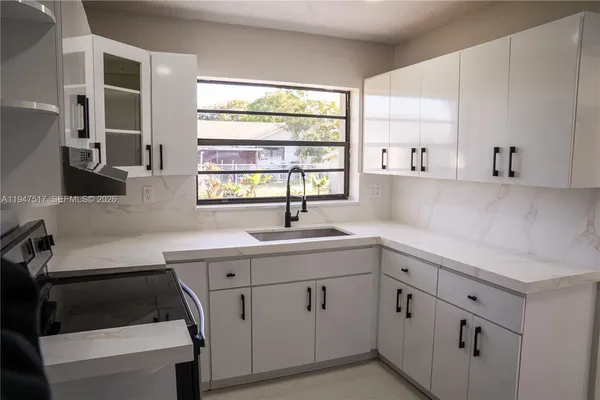 a bathroom with a double vanity sink toilet and shower