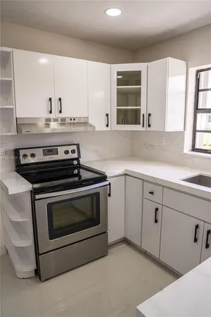 a kitchen with a sink and a window