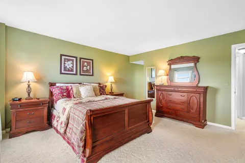 a bedroom with a bed and a cabinets