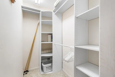 a view of an empty walk in closet