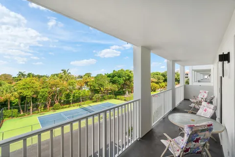 a view of a balcony with furniture