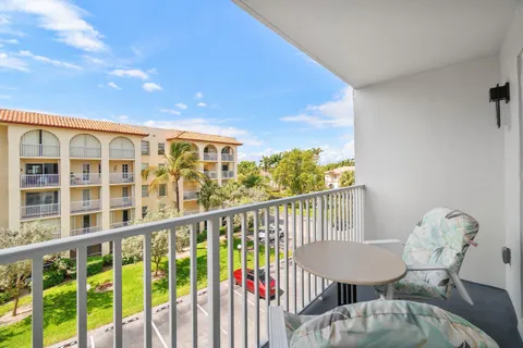 a view of a balcony with furniture