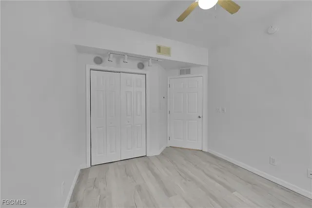 a view of room with hardwood floor