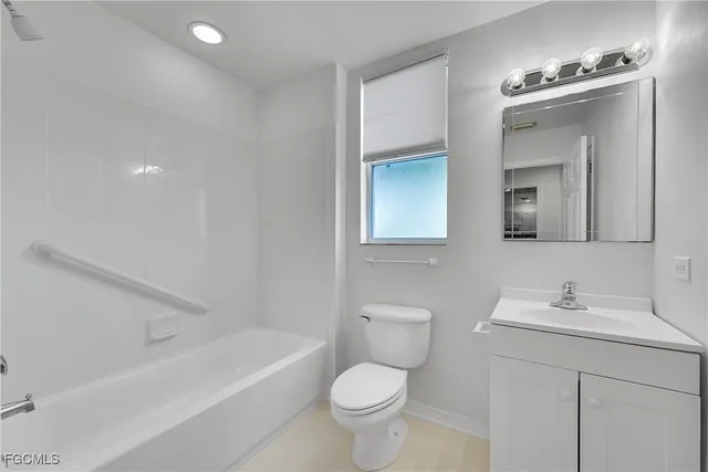 a bathroom with a toilet a sink and a bathtub