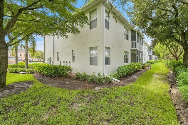 a living room with lots of furniture and a chandelier