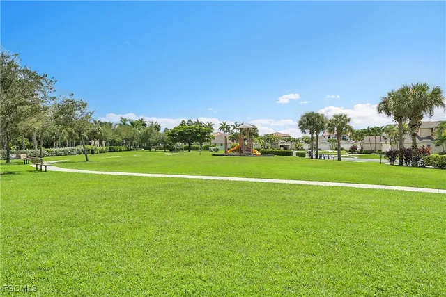 a living room with lots of furniture and a chandelier