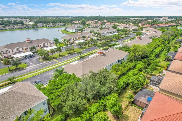 an aerial view of a house with a lake view