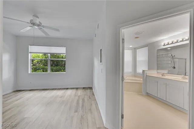 a view of room with window and hardwood floor