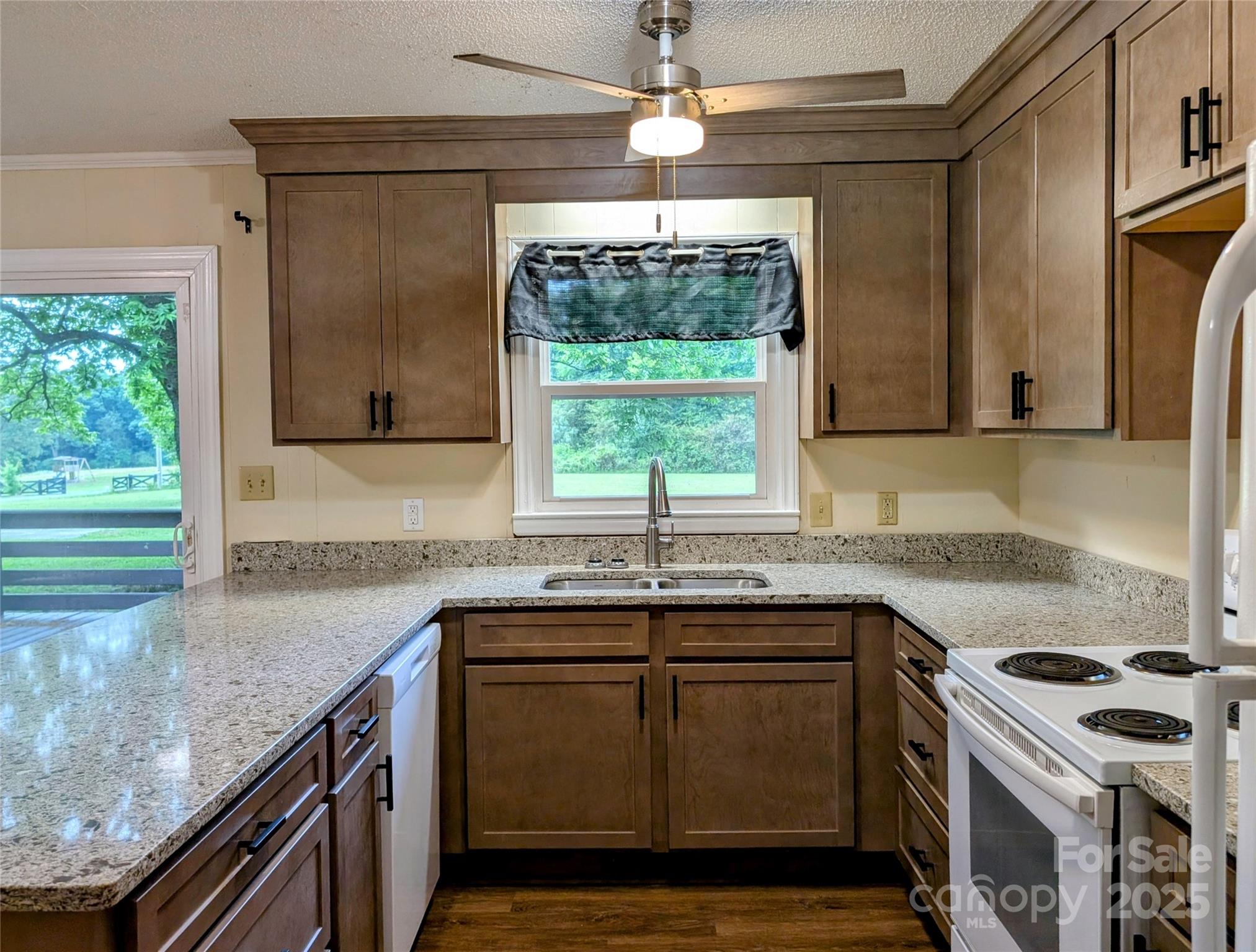 5628 White Store Road Wingate, NC 28174 - Photo 14 of 31 a kitchen with a sink stove and microwave