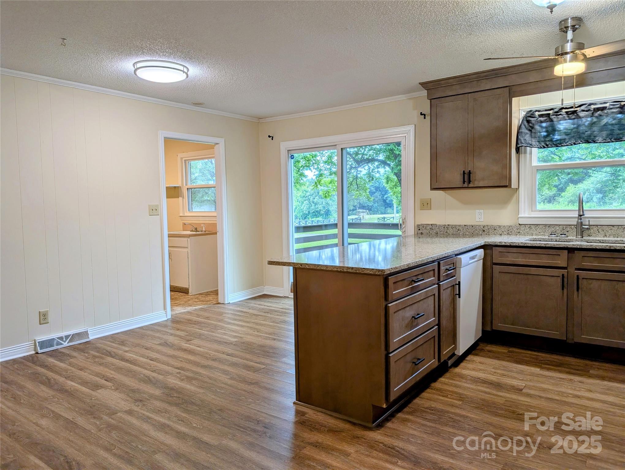 5628 White Store Road Wingate, NC 28174 - Photo 15 of 31 a kitchen with stainless steel appliances granite countertop a stove a sink and a microwave