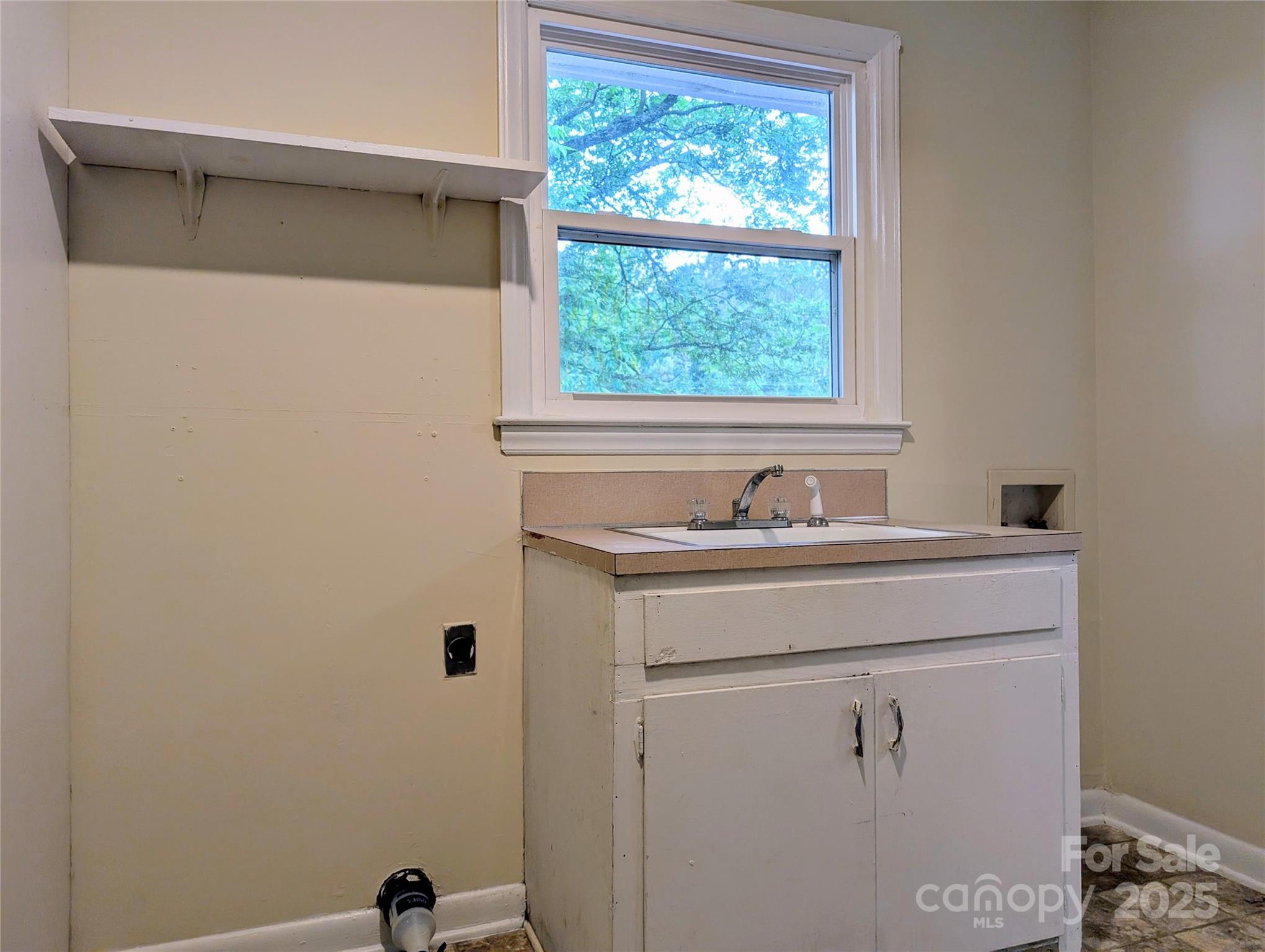 5628 White Store Road Wingate, NC 28174 - Photo 18 of 31 a bathroom with a sink and a window